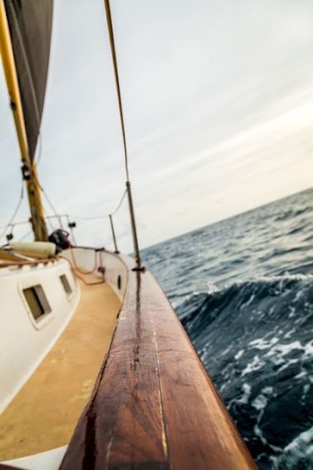 boat sailing on body of water at daytime