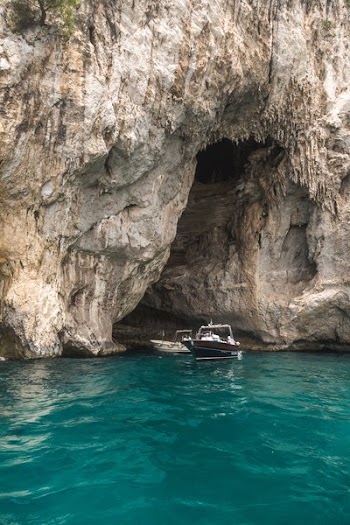 Boats Emerging From Rocks