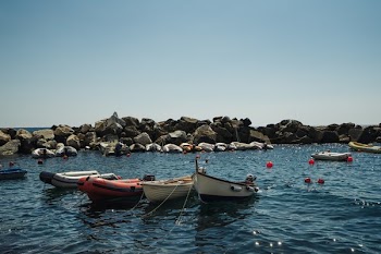 Boats In a Rocky Cove