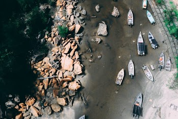 Boats On A Shallow River