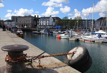 Boats on Body of Water Near Houses