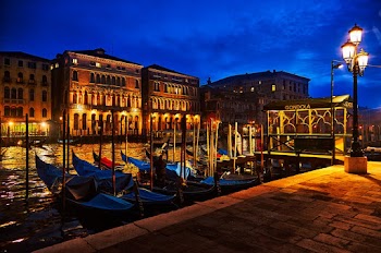 Boats on Body of Water Near Street Light during Nighttime