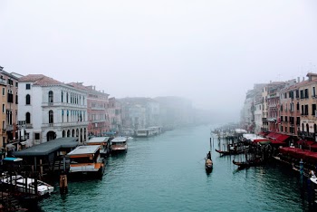Boats on Lake In between Buildings