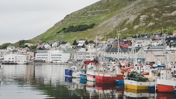 Boats Parked Beside Concrete Buildings