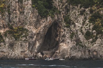 Boats Stop At A Cliff Side