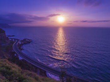 Body of Water Across Sunset