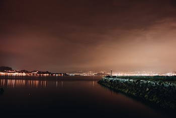 Body of Water Along The City during Nighttime
