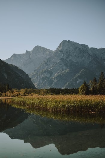 Body of Water and Gray Mountains