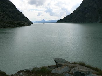 Body of Water and Mountain during Daytime