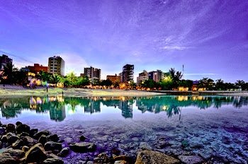 Body of Water Beside Buildings Wallpaper