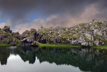 Body of Water Beside Gray Rock