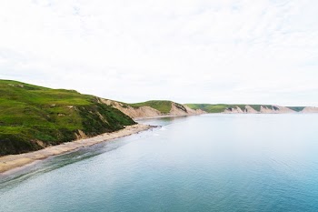 Body of Water Beside Hill