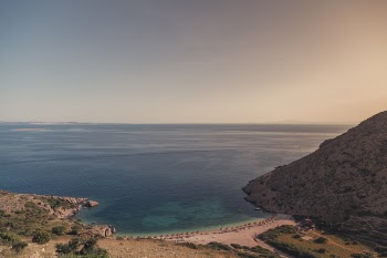 Body of Water Beside Mountain