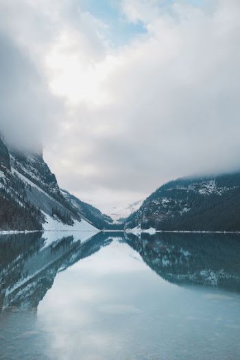 body of water beside mountain