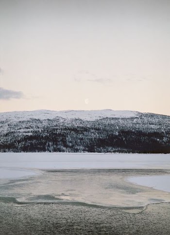 body of water beside mountain
