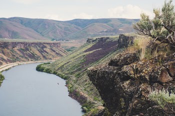 Body of Water Between Mountains
