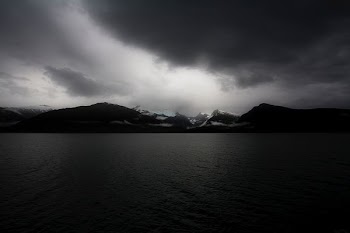 body of water during cloudy daytime