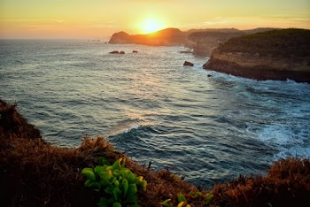 Body Of Water During Sunset