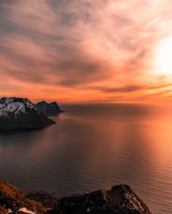 Body Of Water During Sunset