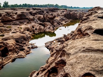 Body of Water in Between Rock Formation