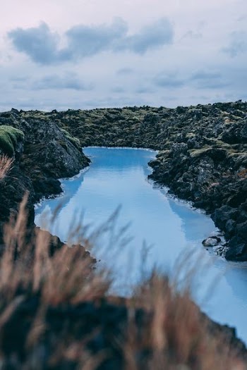 body of water in the middle of stones