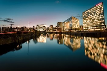 body of water near city buildings