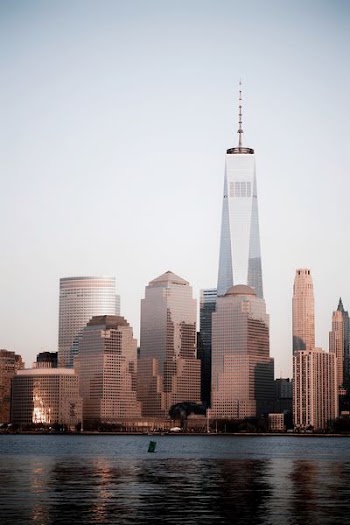 body of water near high-rise buildings illustration