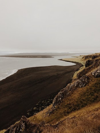 Body Of Water Near Mountain
