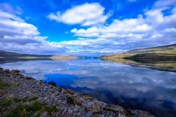 Body of Water Near Mountain