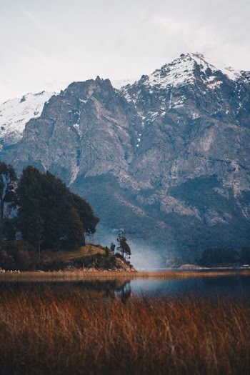 body of water near mountain