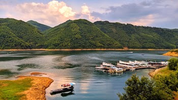 Body Of Water Near Mountain