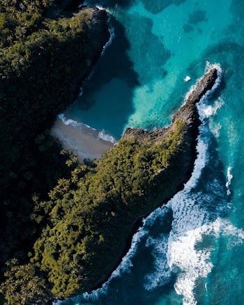 body of water near mountains