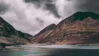 Body of Water Near Mountains