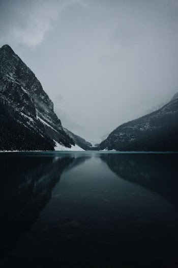 body of water near mountains photography