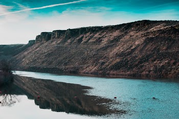 Body of Water Near Rock Formation