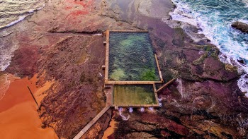 Body Of Water Near Rock Formations