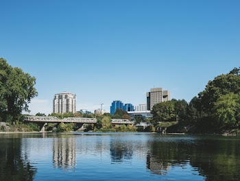 Body of Water Near Trees and Buildings