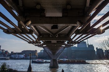 Body of Water over Gray Concrete Bridge