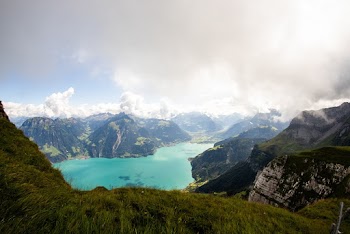 Body of Water Surrounded by Mountains