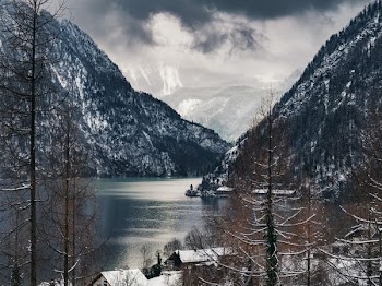 body of water surrounded with mountains