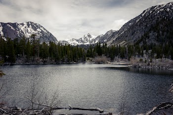 Body of Water Surrounded With Mountains