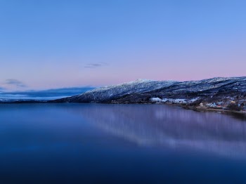 Body of Water Under Blue Sky