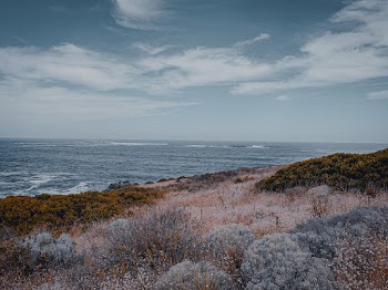 Body of Water Under Blue Sky