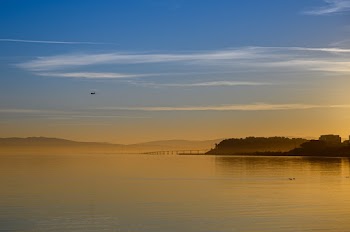 Body of Water Under Blue Sky