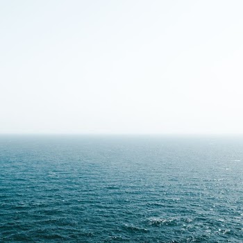 body of water under bright sky