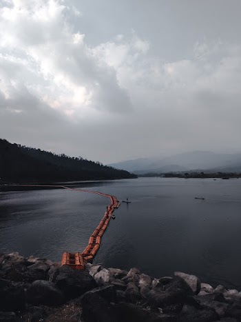 Body of Water Under Cloudy Sky