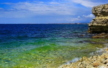 Body of Water Under Cloudy Sky during Daytime