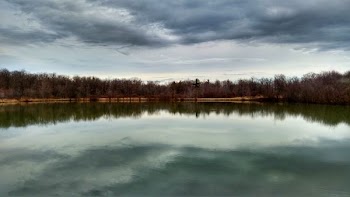 body of water under cloudy sky during daytime
