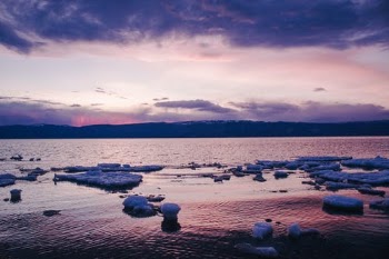Body of Water Under Cloudy Sky · Free Stock Photo