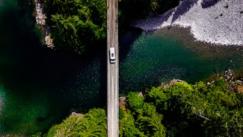 Body of Water Under Gray Concrete Bridge
